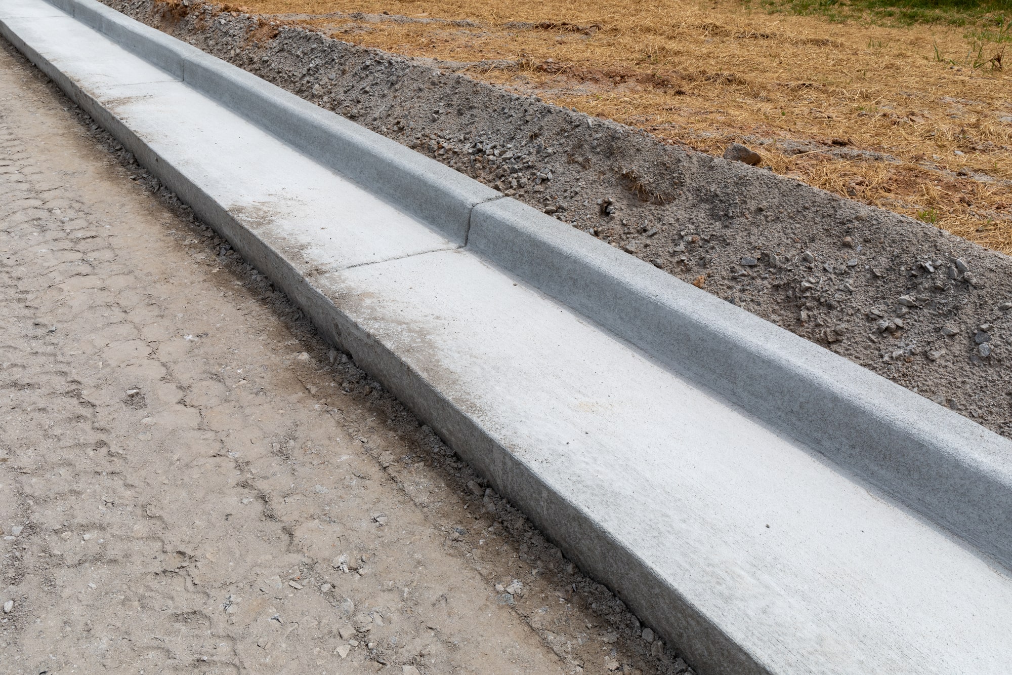 From Design to Installation: Understanding the Process of Constructing Concrete Curb and Gutter Systems