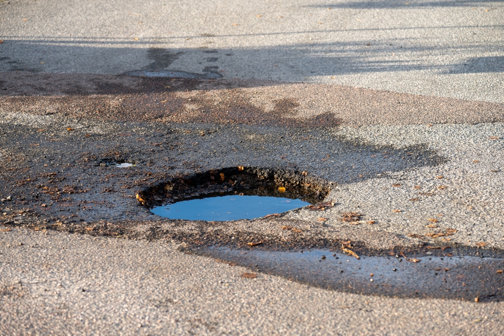 Deep pothole in a parking lot