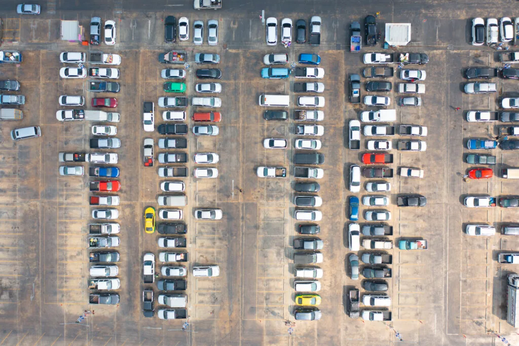 Aerial view of freshly painted parking lot striping on asphalt surface