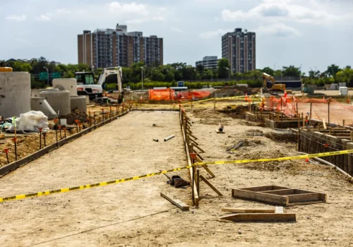 Active commercial site development project featuring grading, utility preparation, and infrastructure construction.