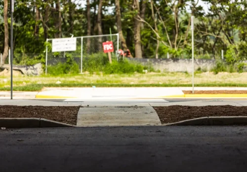 ADA-compliant curb ramp providing accessible pedestrian access between sidewalks and paved surfaces.