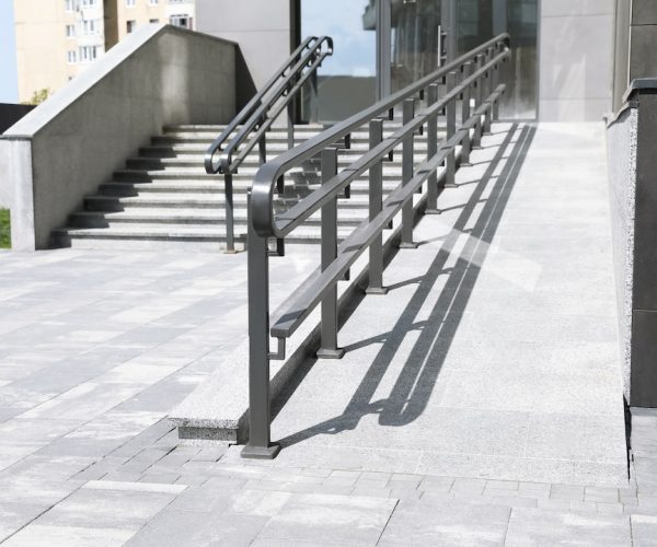 Outdoor stairs with ramp and metal railing