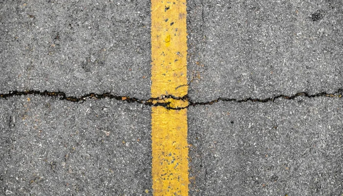 Asphalt crack on line yellow on road before asphalt crack repair/crackfilling job