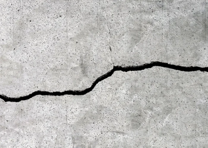 Cracked cement floor texture for background.
