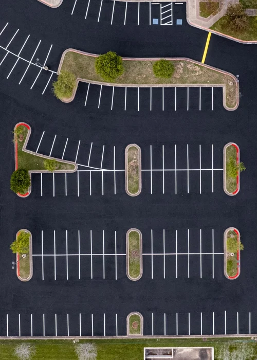 Parking lot maintenance with fresh line striping and organized asphalt parking spaces